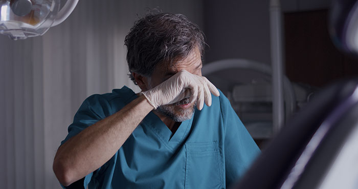 exhausted dentist web