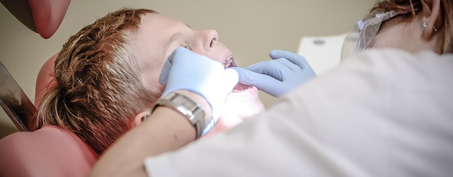 Dentist examining patient